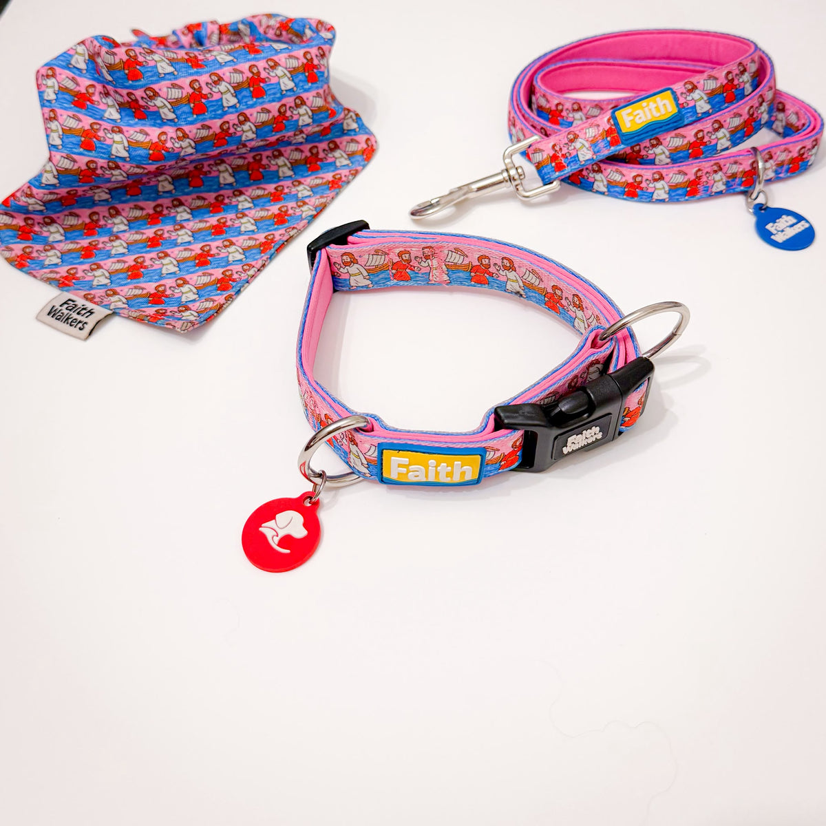 Walk by Faith pink dog collar, leash and matching bandana with a colorful biblical scene pattern.